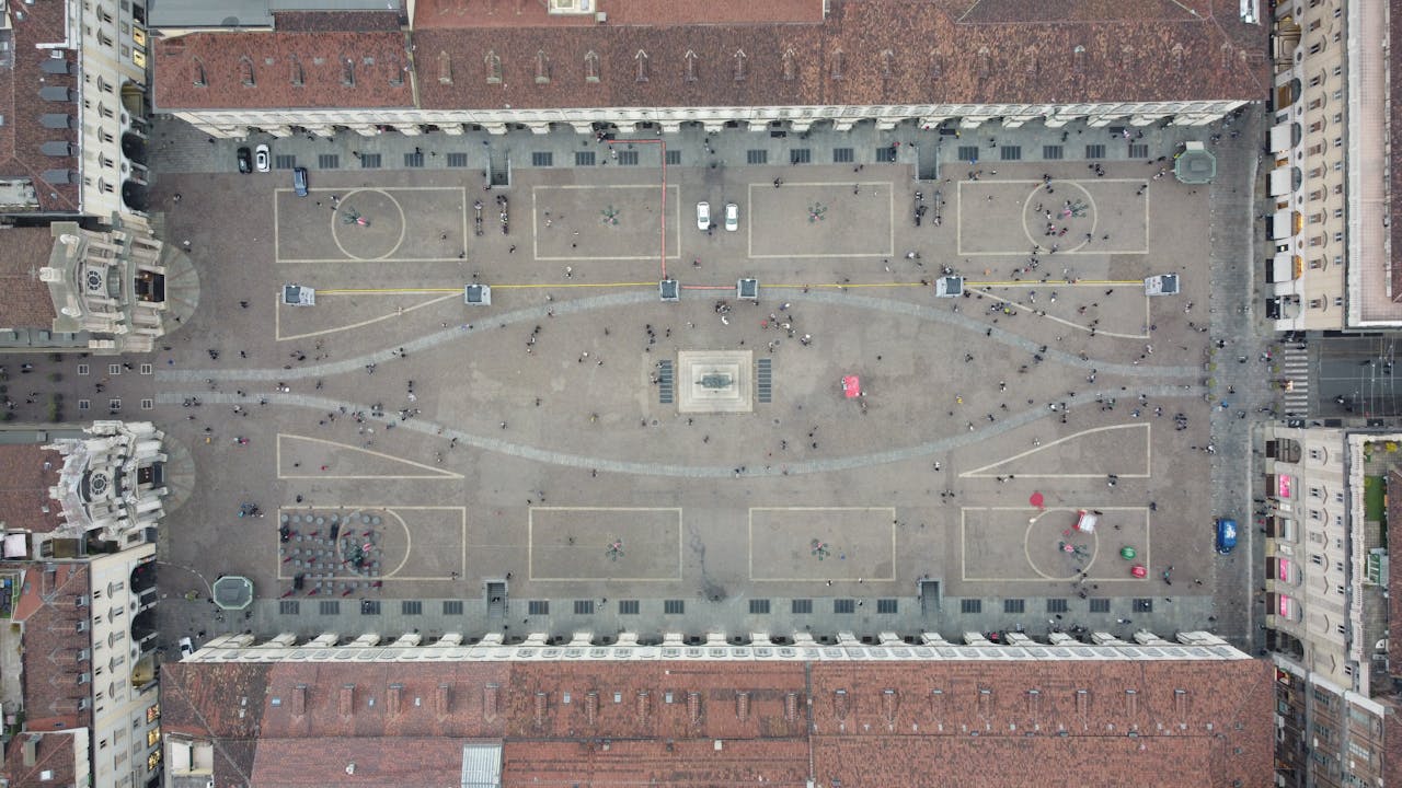 Drone view of Piazza San Carlo in Turin, Italy, capturing its iconic architecture and vibrant urban life.