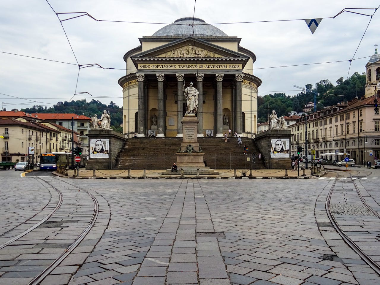 View of Gran Madre di Dio Church in Turin, Italy, showcasing its neoclassical architecture and public square.